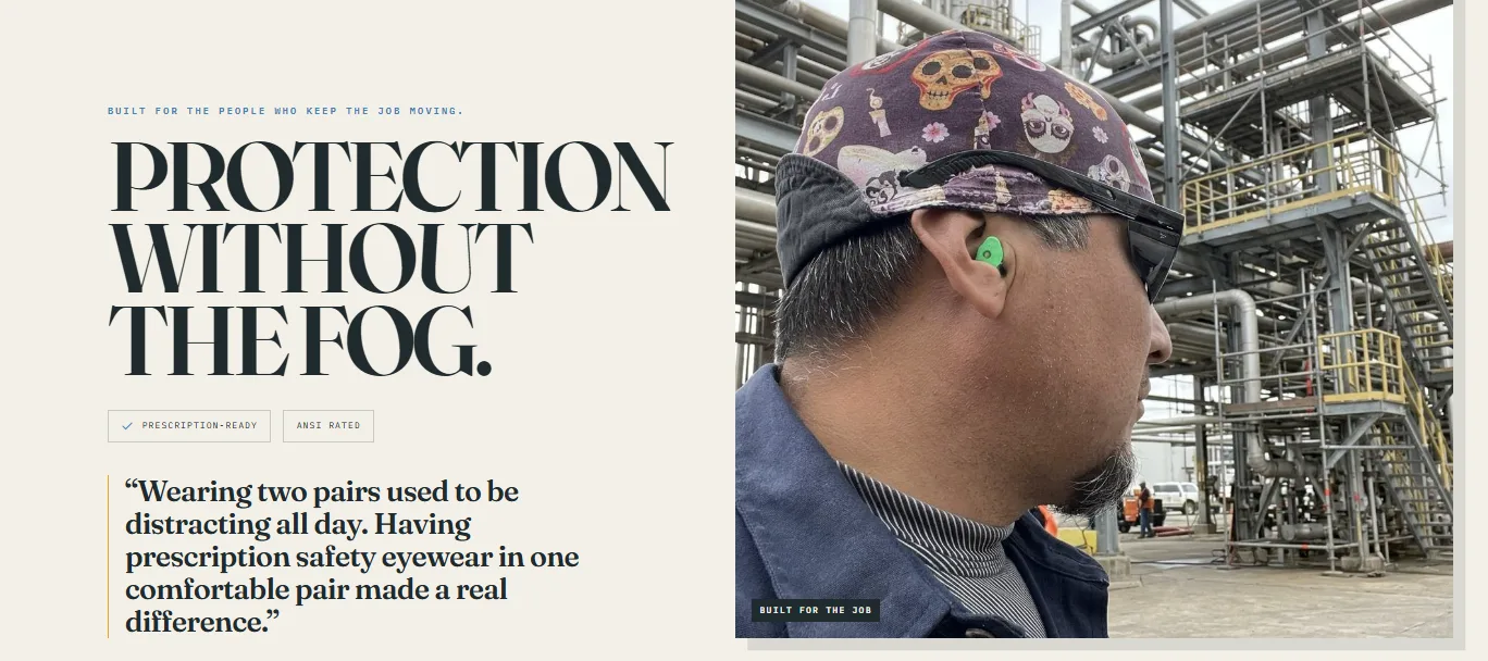 Man at an industrial job site wearing safety glasses